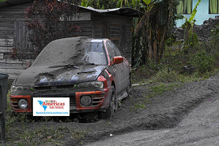 ash-covered-car-and-road-in-chateaubelair-st-Vincent-naan-image
