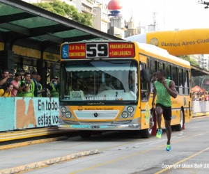 Usain Bolt runs against the Metro Bus