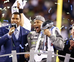 Seattle Seahawks outside linebacker Malcolm Smith (53) celebrates with the Lombardi Trophy after being named most valuable player in Super Bowl XLVIII at Metlife Stadium on Sunday, Feb. 2, 2014, in East Rutherford, N.J. (Steve Sanders/NFL)