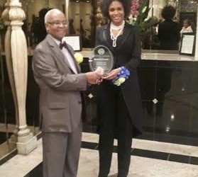 marie-claire and President of the Westbridge NAACP, Julian McDavid pose with award.