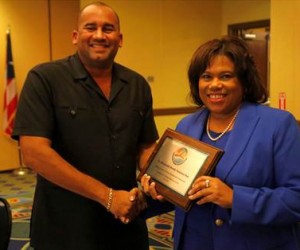 Barbados Minister of Tourism and International Transport, Richard Sealy takes the reins from USVI Commissioner of Tourism, Beverly Nicholson-Doty 