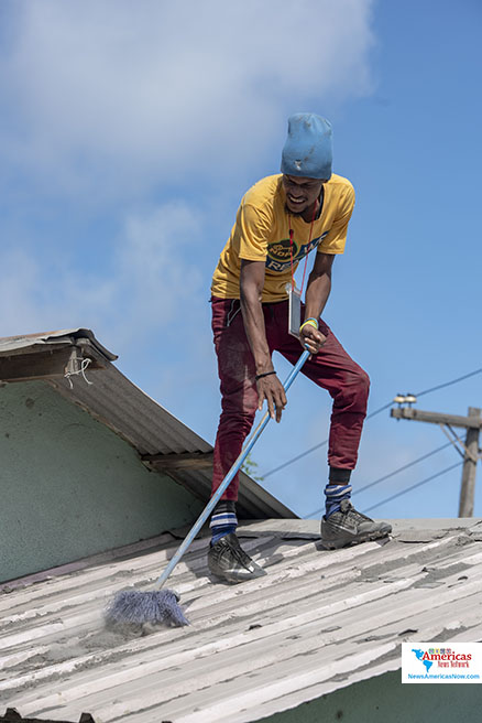 cleaning-rock-hard-ash-off-a-roof-in-owia-st-vincent