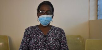 health-news-haitian-vaccinated-cleaning-lady