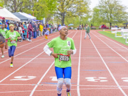 Colgate Women’s Games runner, Caribbean roots Kushanna Medas-King, completing her race at Queens College. (Photo by Elliot Mangual/Colgate-Palmolive)