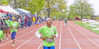 Colgate Women’s Games runner, Caribbean roots Kushanna Medas-King, completing her race at Queens College. (Photo by Elliot Mangual/Colgate-Palmolive)