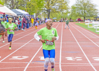 Colgate Women’s Games runner, Caribbean roots Kushanna Medas-King, completing her race at Queens College. (Photo by Elliot Mangual/Colgate-Palmolive)