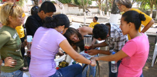 D-Lab students and Amy Smith working on a "bici-blender," El Salvador, 2013.