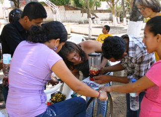 D-Lab students and Amy Smith working on a "bici-blender," El Salvador, 2013.