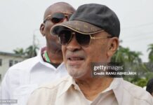 Suriname's former president (2010-2020) Desi Bouterse walks next to a body guard while leaving the High Court of Justice after a hearing in his appeals case in the December 8, 1982 murders, in Paramaribo on January 31, 2023. - Suriname's public prosecutor's office reaffirmed its request for a 20-year prison sentence for Bouterse if the sentence against him for the execution of 15 opponents in 1982 is upheld. Attorney General Carmen Rasam also formally requested Bouterse's imprisonment if the sentence is confirmed. (Photo by Ranu Abhelakh / AFP) (Photo by RANU ABHELAKH/AFP via Getty Images)