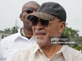 Suriname's former president (2010-2020) Desi Bouterse walks next to a body guard while leaving the High Court of Justice after a hearing in his appeals case in the December 8, 1982 murders, in Paramaribo on January 31, 2023. - Suriname's public prosecutor's office reaffirmed its request for a 20-year prison sentence for Bouterse if the sentence against him for the execution of 15 opponents in 1982 is upheld. Attorney General Carmen Rasam also formally requested Bouterse's imprisonment if the sentence is confirmed. (Photo by Ranu Abhelakh / AFP) (Photo by RANU ABHELAKH/AFP via Getty Images)