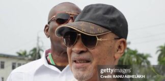 Suriname's former president (2010-2020) Desi Bouterse walks next to a body guard while leaving the High Court of Justice after a hearing in his appeals case in the December 8, 1982 murders, in Paramaribo on January 31, 2023. - Suriname's public prosecutor's office reaffirmed its request for a 20-year prison sentence for Bouterse if the sentence against him for the execution of 15 opponents in 1982 is upheld. Attorney General Carmen Rasam also formally requested Bouterse's imprisonment if the sentence is confirmed. (Photo by Ranu Abhelakh / AFP) (Photo by RANU ABHELAKH/AFP via Getty Images)