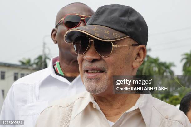 Suriname's former president (2010-2020) Desi Bouterse walks next to a body guard while leaving the High Court of Justice after a hearing in his appeals case in the December 8, 1982 murders, in Paramaribo on January 31, 2023. - Suriname's public prosecutor's office reaffirmed its request for a 20-year prison sentence for Bouterse if the sentence against him for the execution of 15 opponents in 1982 is upheld. Attorney General Carmen Rasam also formally requested Bouterse's imprisonment if the sentence is confirmed. (Photo by Ranu Abhelakh / AFP) (Photo by RANU ABHELAKH/AFP via Getty Images)